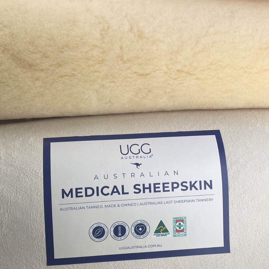 Sheepskin fabric with a label indicating 'Australian Medical Sheepskin' on a beige background.